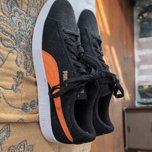 Puma Black Sneakers with Vibrant Orange Stripe
